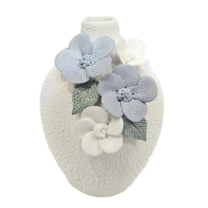 water droplets textured ceramic vase with light blue and white flowers vase