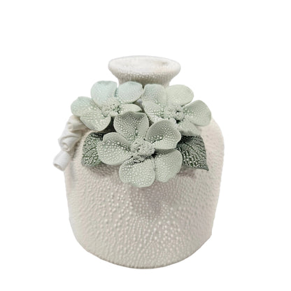 Textured white ceramic vase decorative pastel green floral accents pot