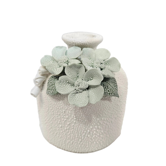 Textured white ceramic vase decorative pastel green floral accents pot