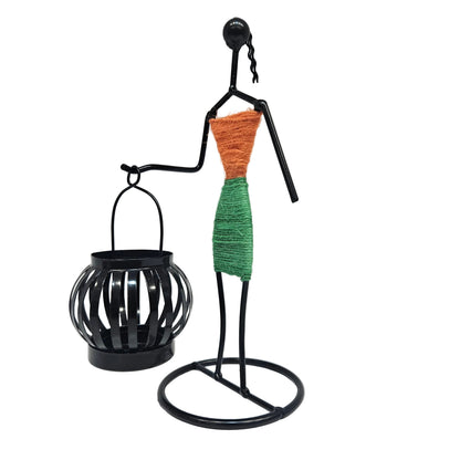 Retro Style Candlestick Figurine features a handcrafted metal silhouette holding a small black lantern Showpiece