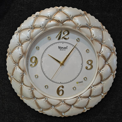 Decorative wall clock with intricate design on a dark background