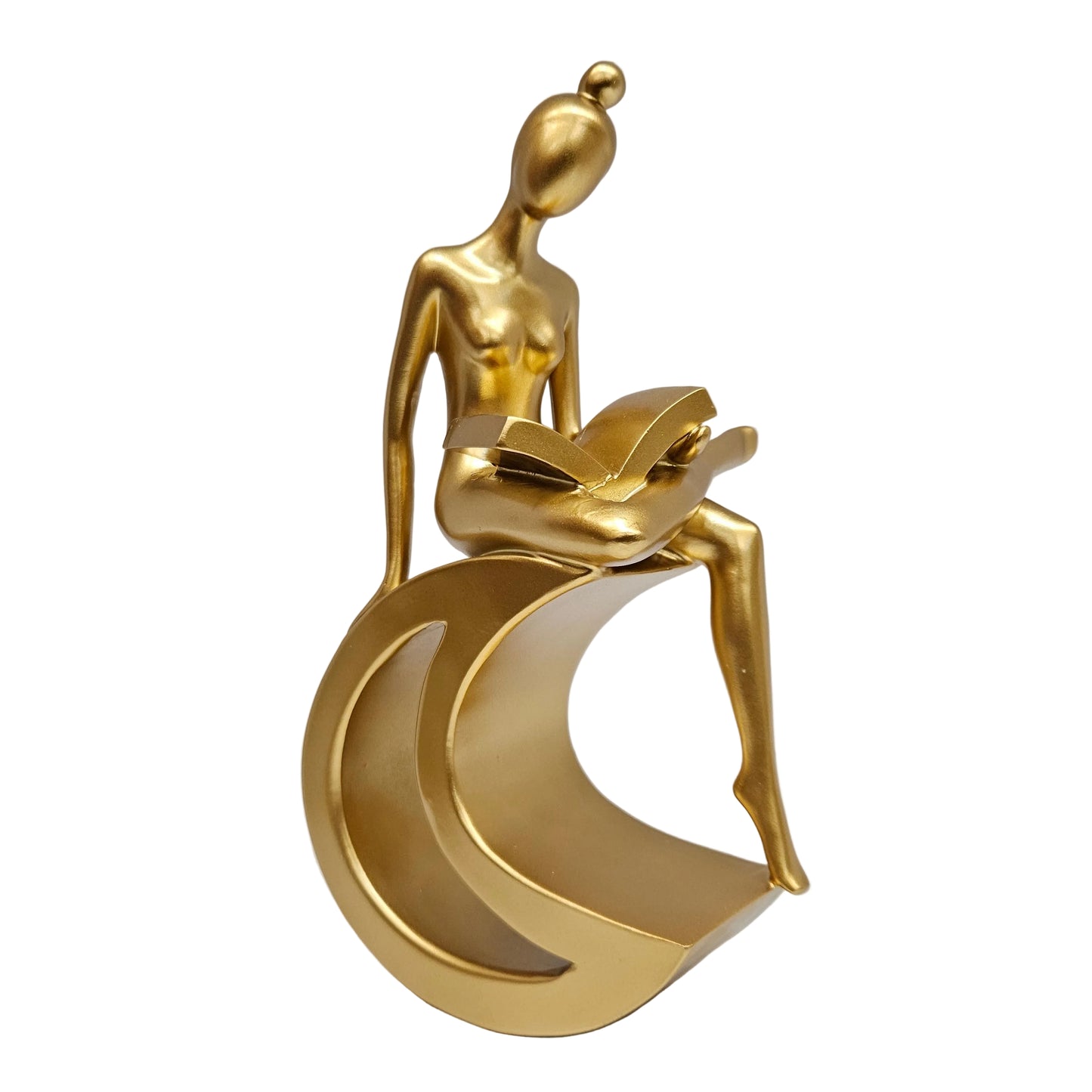 Gold-finished resin statue depicts a stylized figure reading a book while perched upon a crescent moon.