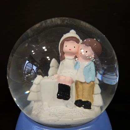 Beautiful love Couple with winter themed multi colour lighting snow Globe