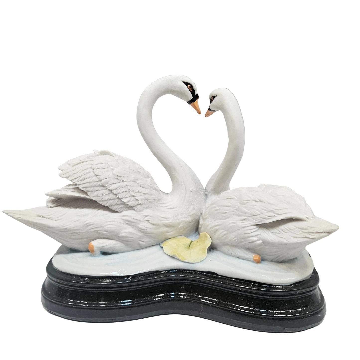 Swan pair showpiece features two white swans forming a heart shape, decorated with pink flowers