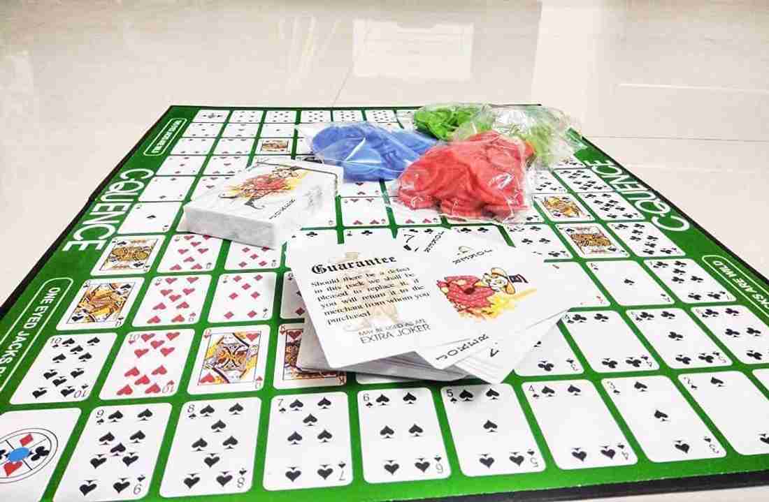 the "C-Quence" board game, a strategy game for ages 7 and up. It is designed for 2-12 players and involves forming sequences of five chips in a row on the game board.