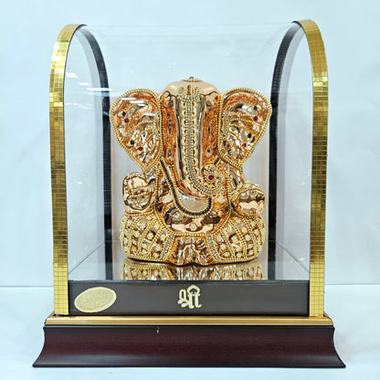 Lord Vinayaka murti 24carats gold Plated idol with attractive stones designed Statue in a transparent protective cabin