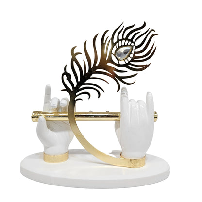 Lord Krishna hand idol features white resin hands holding a flute and a prominent peacock feather Showpiece