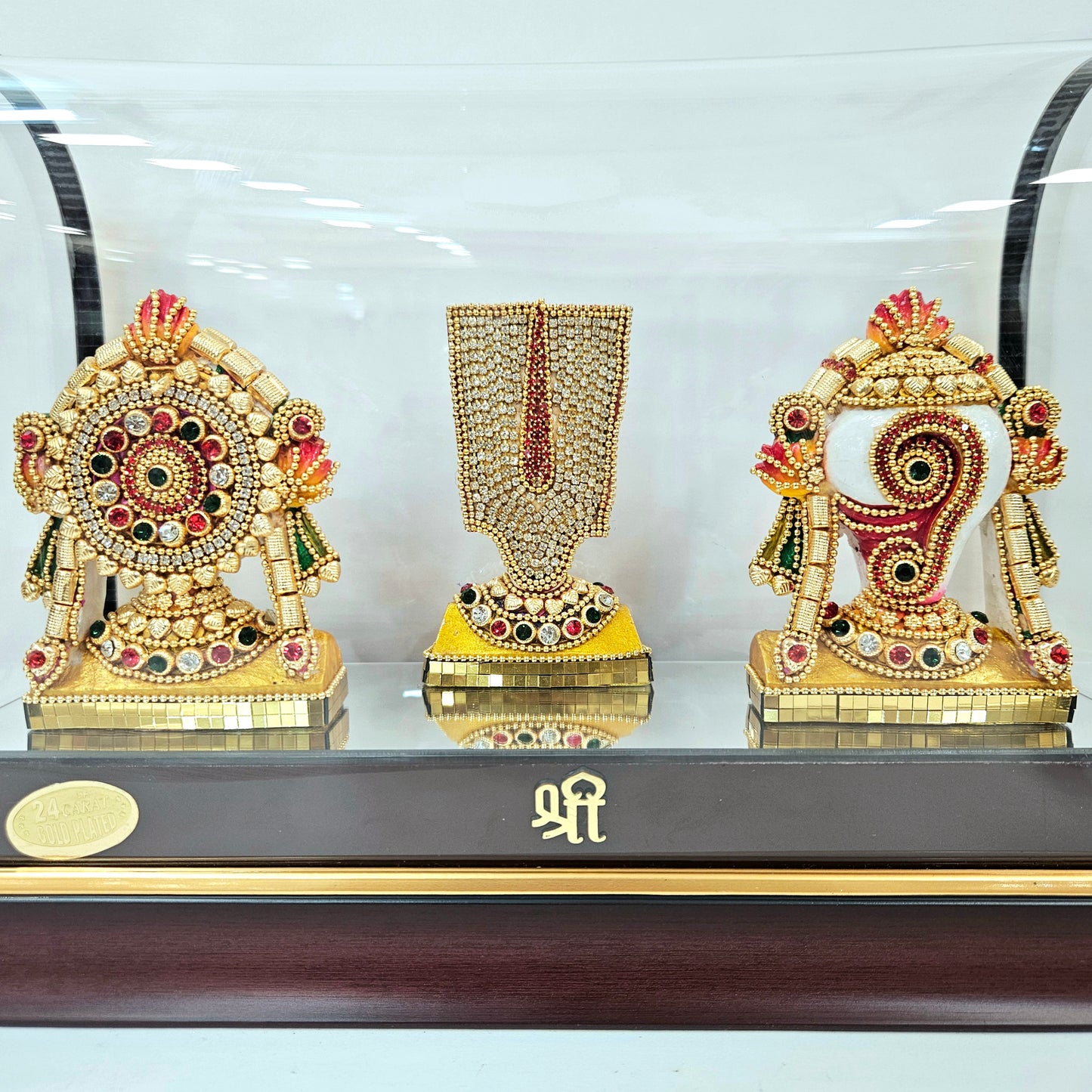 Shank Chakra Tilak 24carats gold Plated idol Decorated with attractive stones designed in a transparent protective cabin