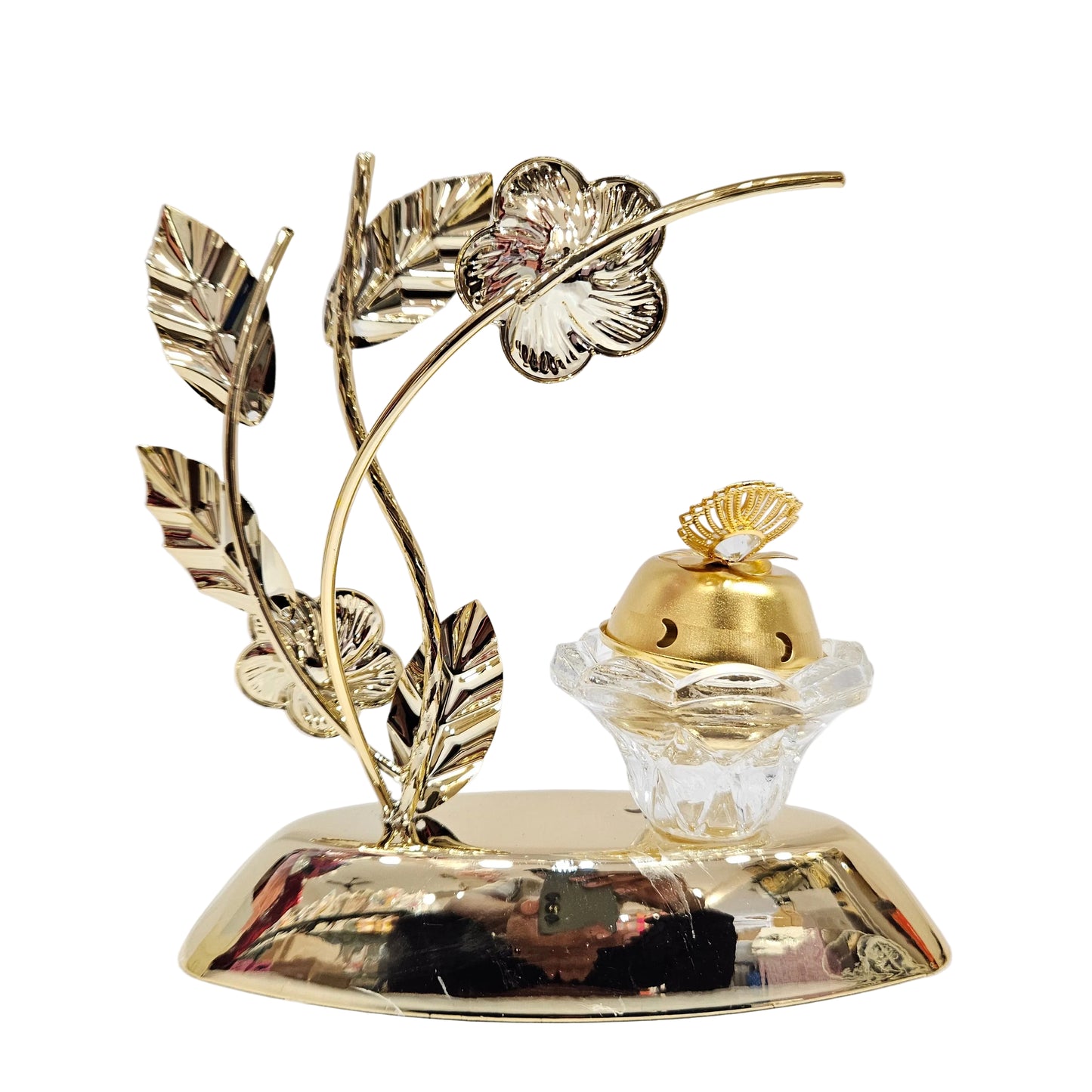 Gold-toned metal showpiece features floral and leaf designs and a glass base for a candle or incense burner