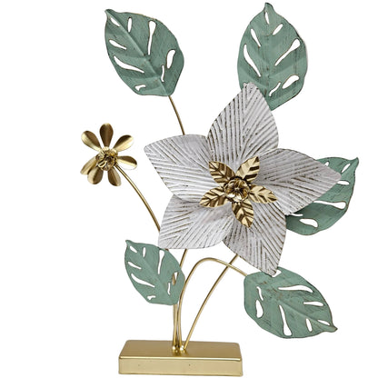 Decorative metal flower features a prominent white and gold center blossom with sage green leaves Showpiece
