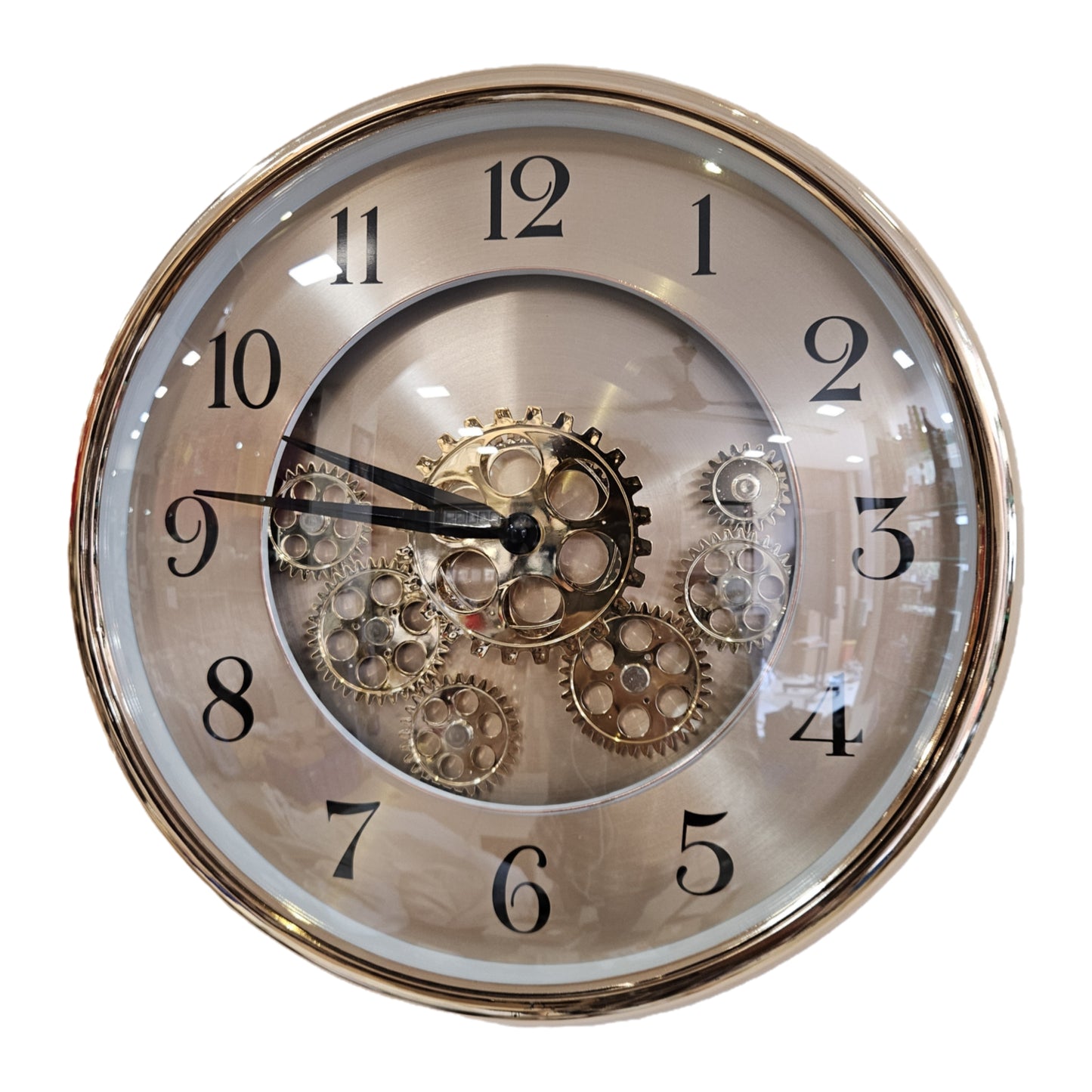 Decorative wall clock with visible gears on a white background