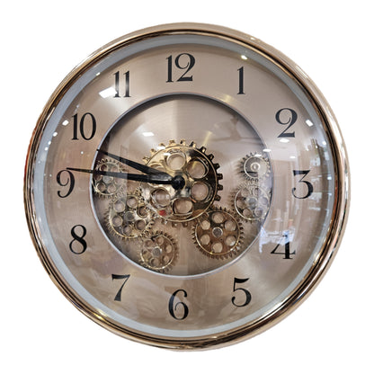 Decorative wall clock with visible gears on a white background