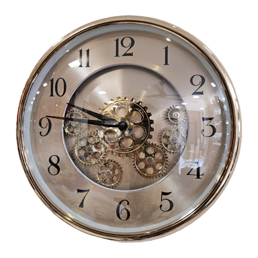 Decorative wall clock with visible gears on a white background