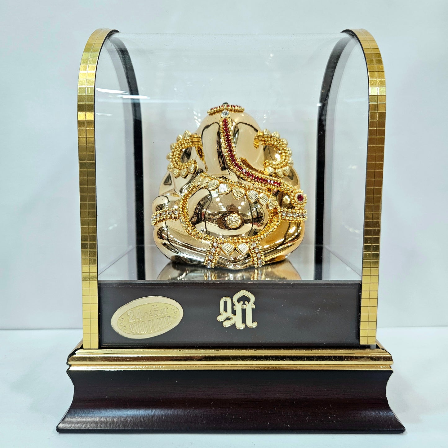 Lord vinayaka murti 24carats gold Plated idol Statue in a transparent protective cabin