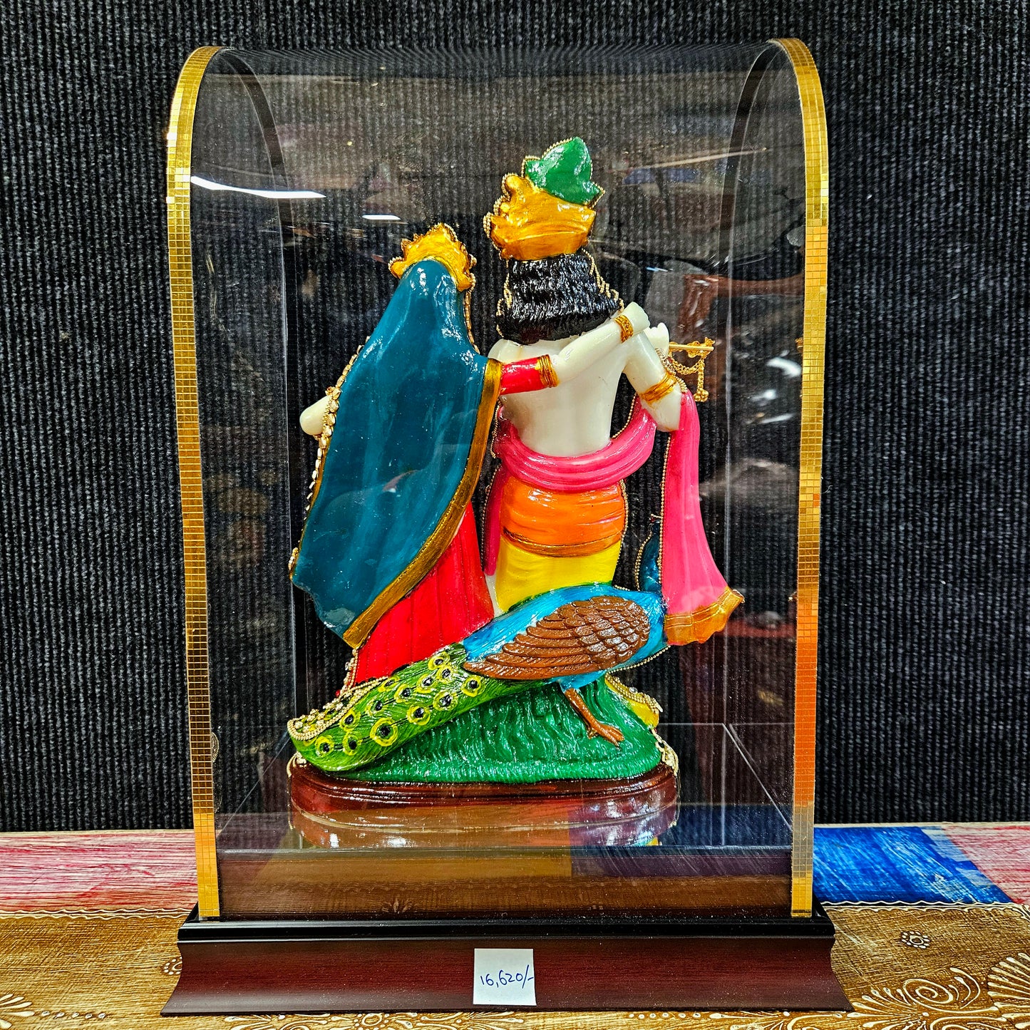 24carat gold Plated attractive Krishna Idol Decorated with stones in a transparent protective cabin