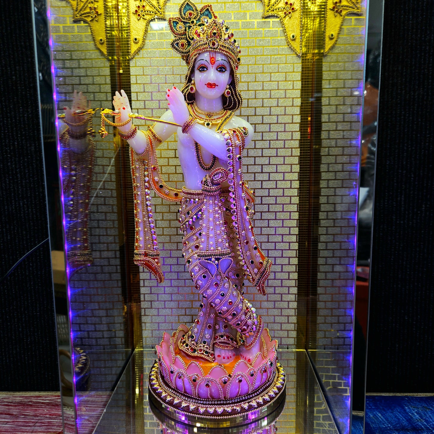 24carats gold Plated Krishna Statue idol Decorated with attractive stones in a transparent protective cabin