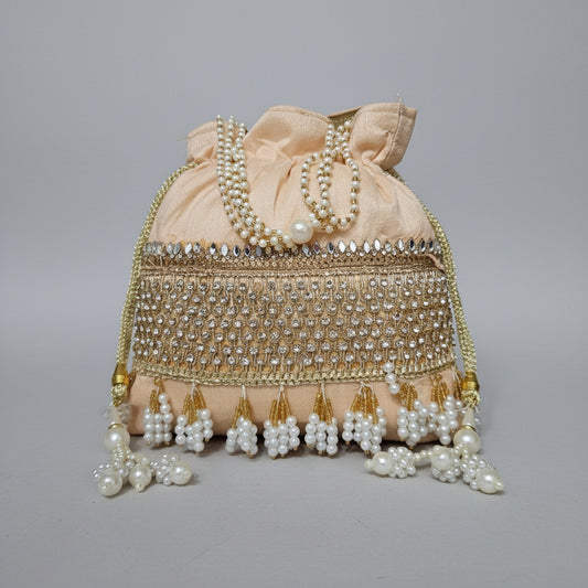 Decorative headpiece with pearls and beads on a black background