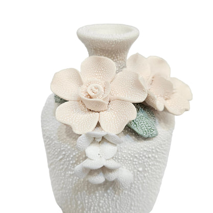 water droplets textured ceramic vase with light blue and white flowers vase