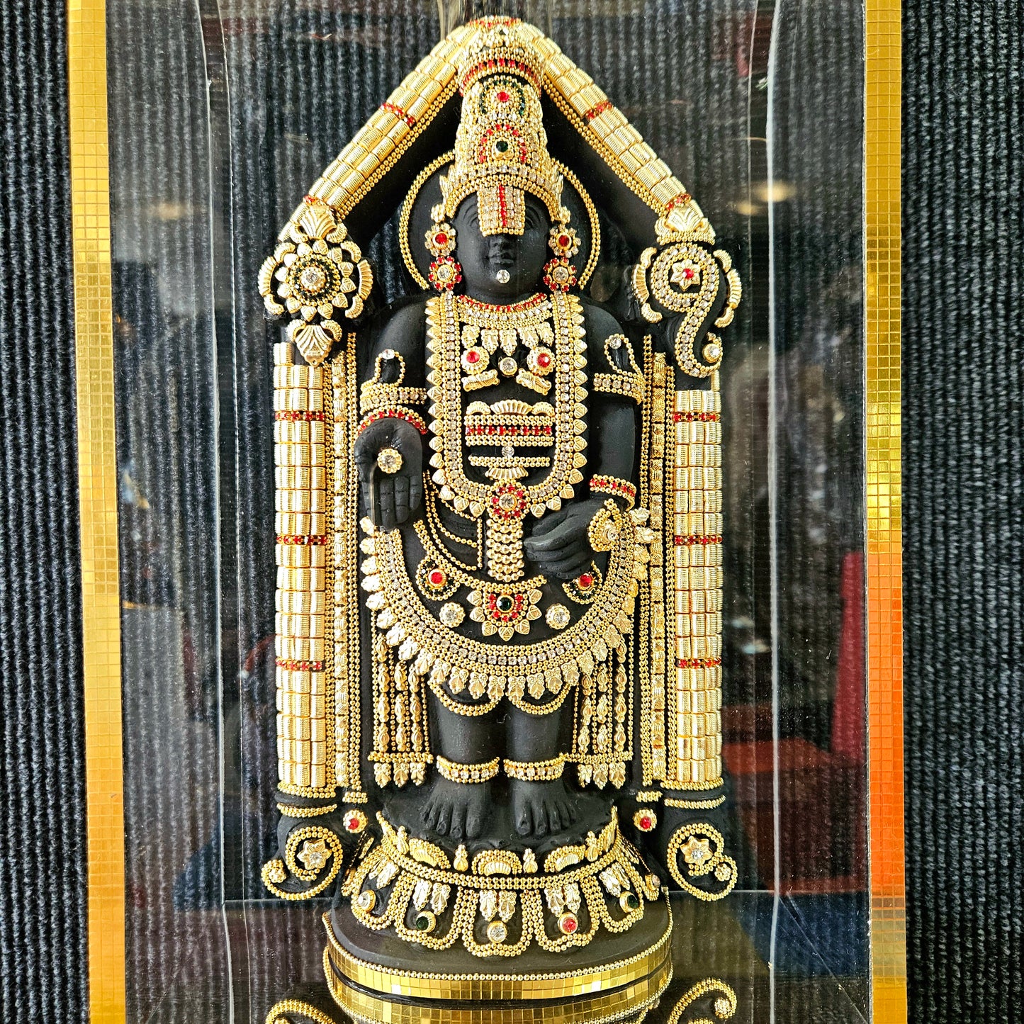 Lord Balaji decorated with attractive stones designed 24 carats gold Plated Statue idol in transparent protective cabin
