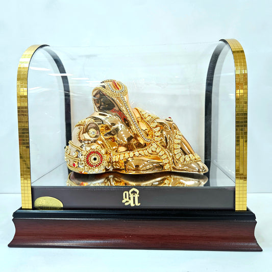 Lord Vinayaka murti 24carats gold Plated idol with attractive stones designed Statue in a transparent protective cabin