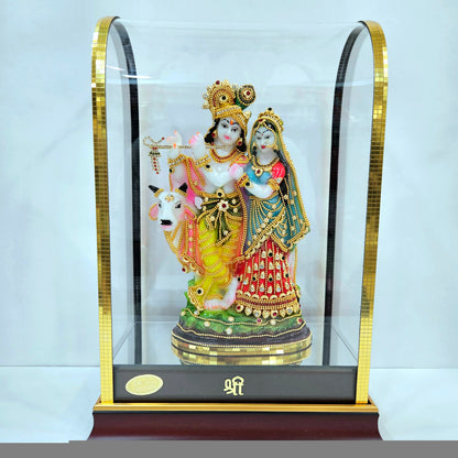 24 carats gold Plated radha Krishna Idol Decorated with attractive stones designed Statue showpiece in transparent protective cabin