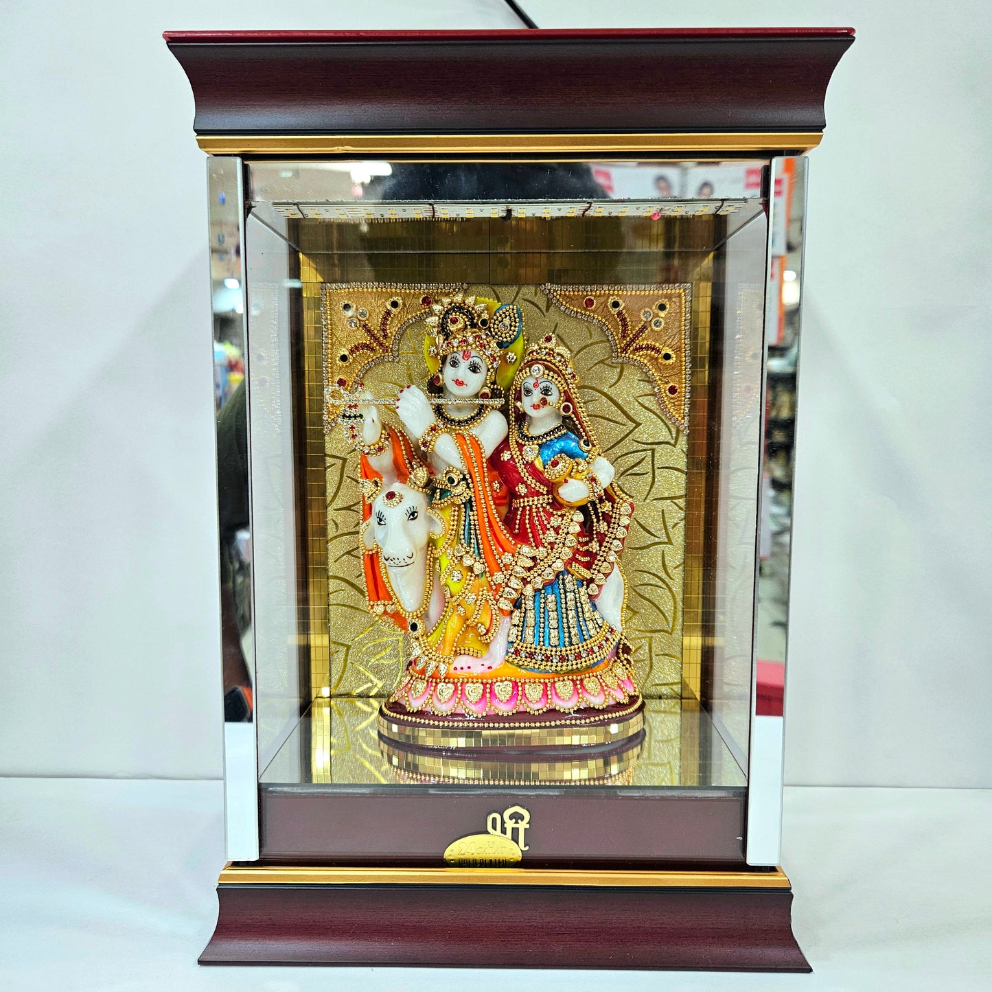 Radha Krishna attractive stones designed 24 carats gold Plated idol Statue showpiece in a transparent protective cabin