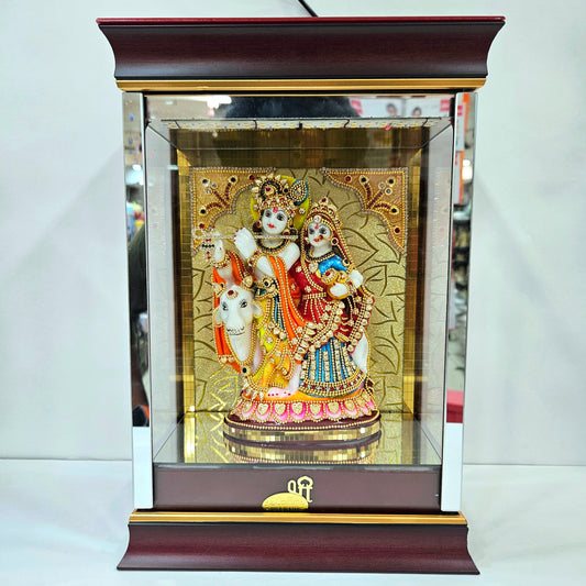 Radha Krishna attractive stones designed 24 carats gold Plated idol Statue showpiece in a transparent protective cabin