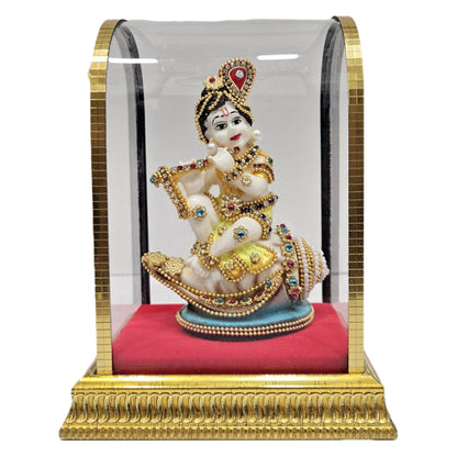 Handcrafted Baby Krishna "Makhan Chor" idol made of polyresin and enclosed in a glass display cabin case