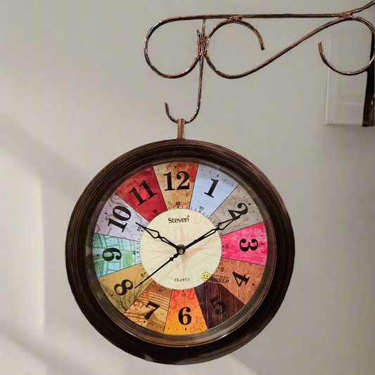 Decorative clock with colorful face on a textured dark surface