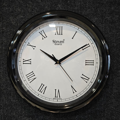 Round wall clock with Roman numerals on a dark textured background