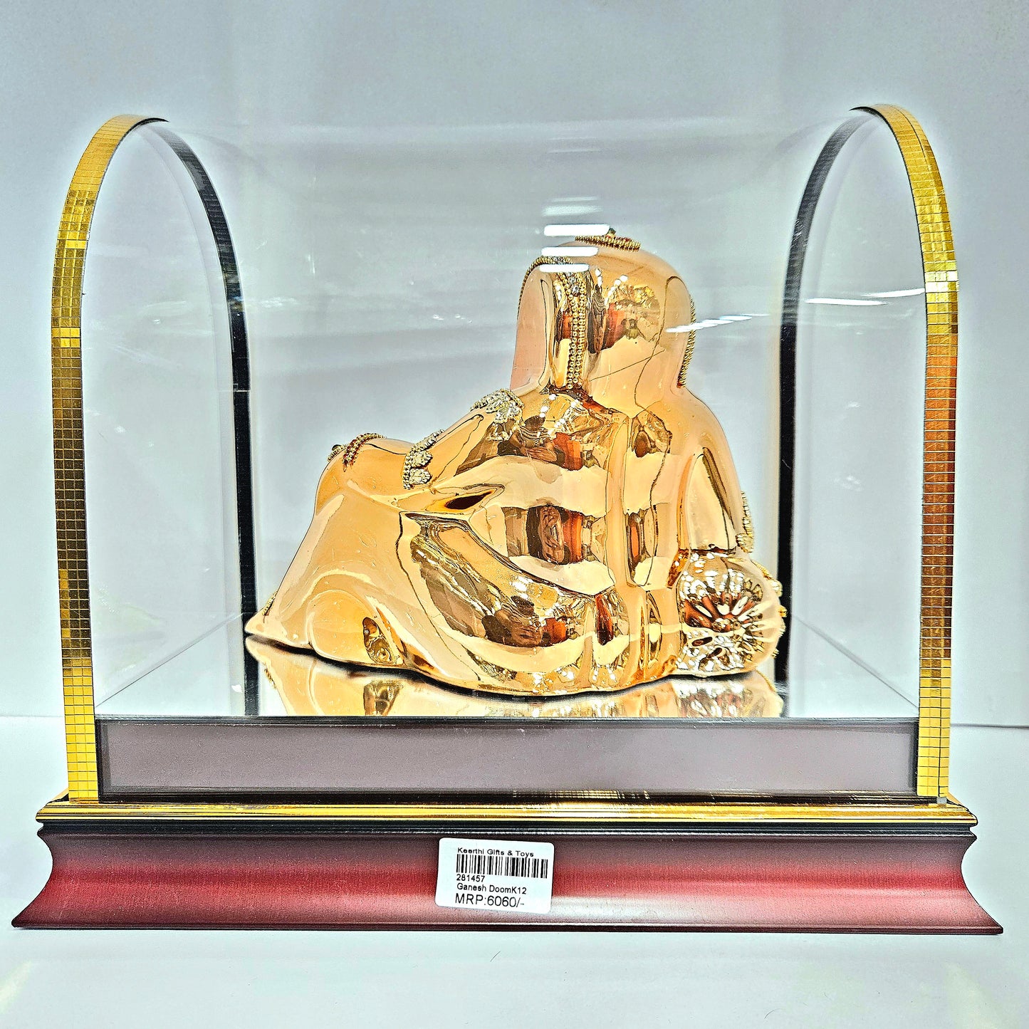 Decorative Ganesh ji Statue idol in resting position with stones design in transparent protective cabin