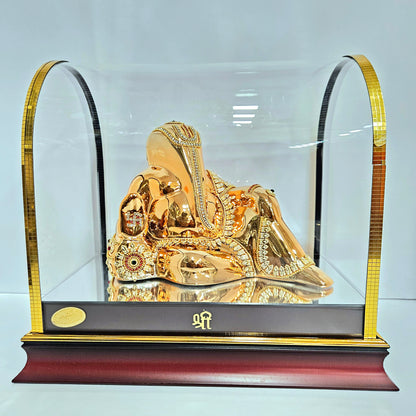 Decorative Ganesh ji Statue idol in resting position with stones design in transparent protective cabin
