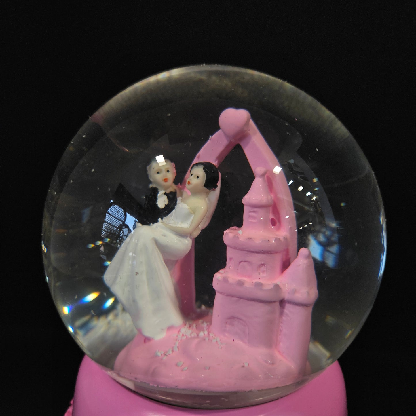 Beautiful married couple with Castle themed multi colour lighting snow Globe