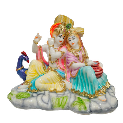 Polyresin Radha Krishna murti features a colorful pink and yellow attire with gold-toned detailing idol Statue showpiece Figurine