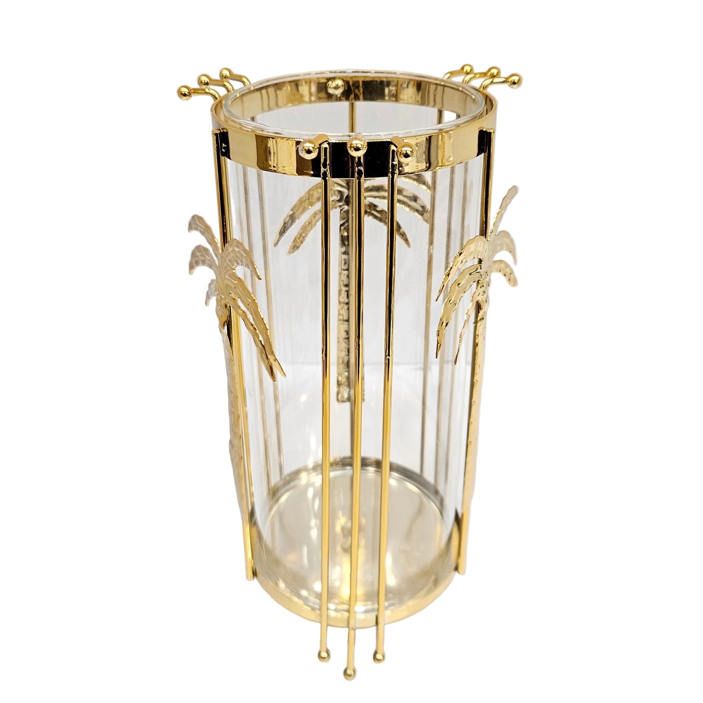 Gold metal hurricane candle holder from Jenny Robert Exclusive Décor a glass insert adorned with palm tree