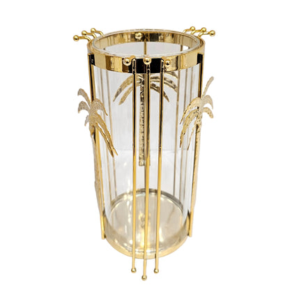 Gold metal hurricane candle holder from Jenny Robert Exclusive Décor a glass insert adorned with palm tree