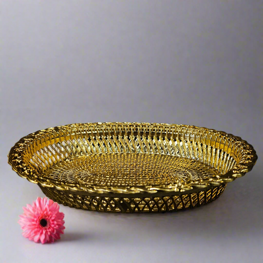 Decorative gold plate with intricate patterns on a black background