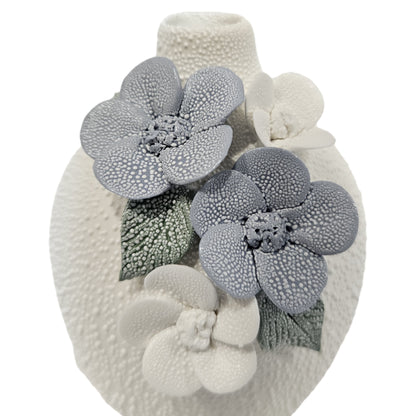 water droplets textured ceramic vase with light blue and white flowers vase