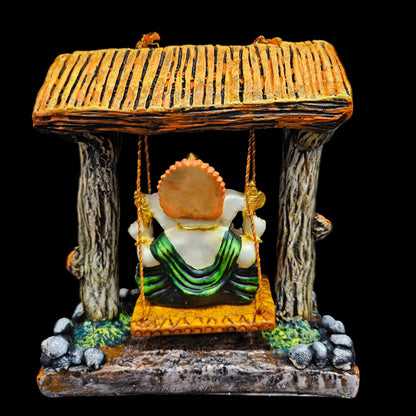 Polyresin Lord Ganesha Idol Resting On A Swing statue Showpiece