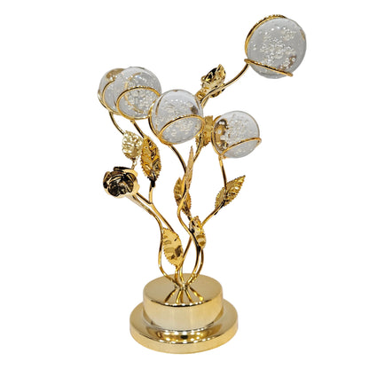 Elegant Golden Floral Crystal Globe Table Centerpiece. It features metallic golden stems with detailed leaves and a rose motif rising from a polished cylindrical base