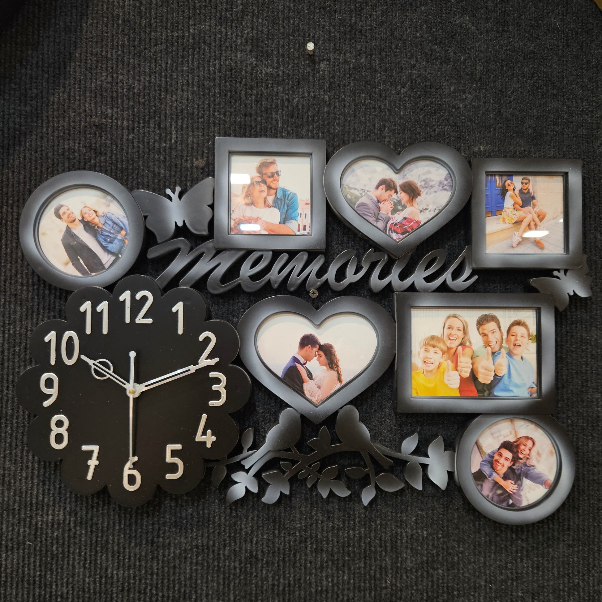 Decorative wall clock with photo frames on a dark textured background