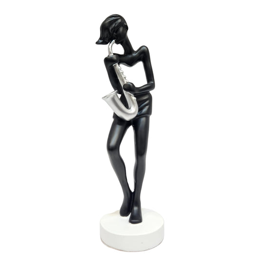 polyresin statue depicts a saxophone player in a black and silver finish, standing approximately tall on a white base