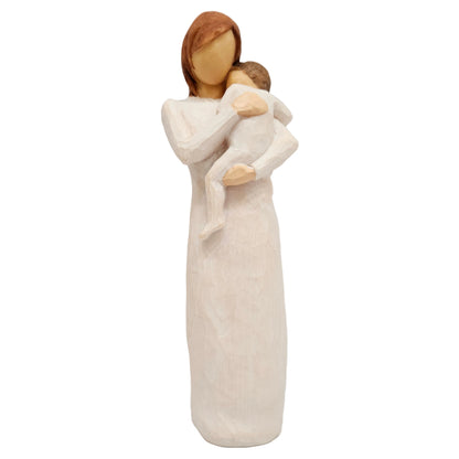 Willow Tree figurine, titled "Child of My Heart" and sculpted by Susan Lordi, parent holding a baby close to their chest