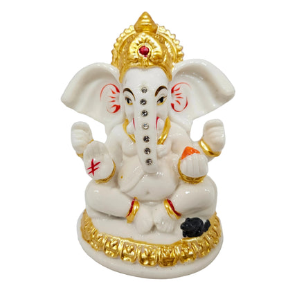 White Ganesh idol is a decorative showpiece, often crafted from polyresin or marble dust for home or car dashboard placement