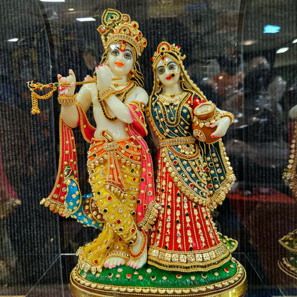 24carat gold Plated attractive Krishna Idol Decorated with stones in a transparent protective cabin