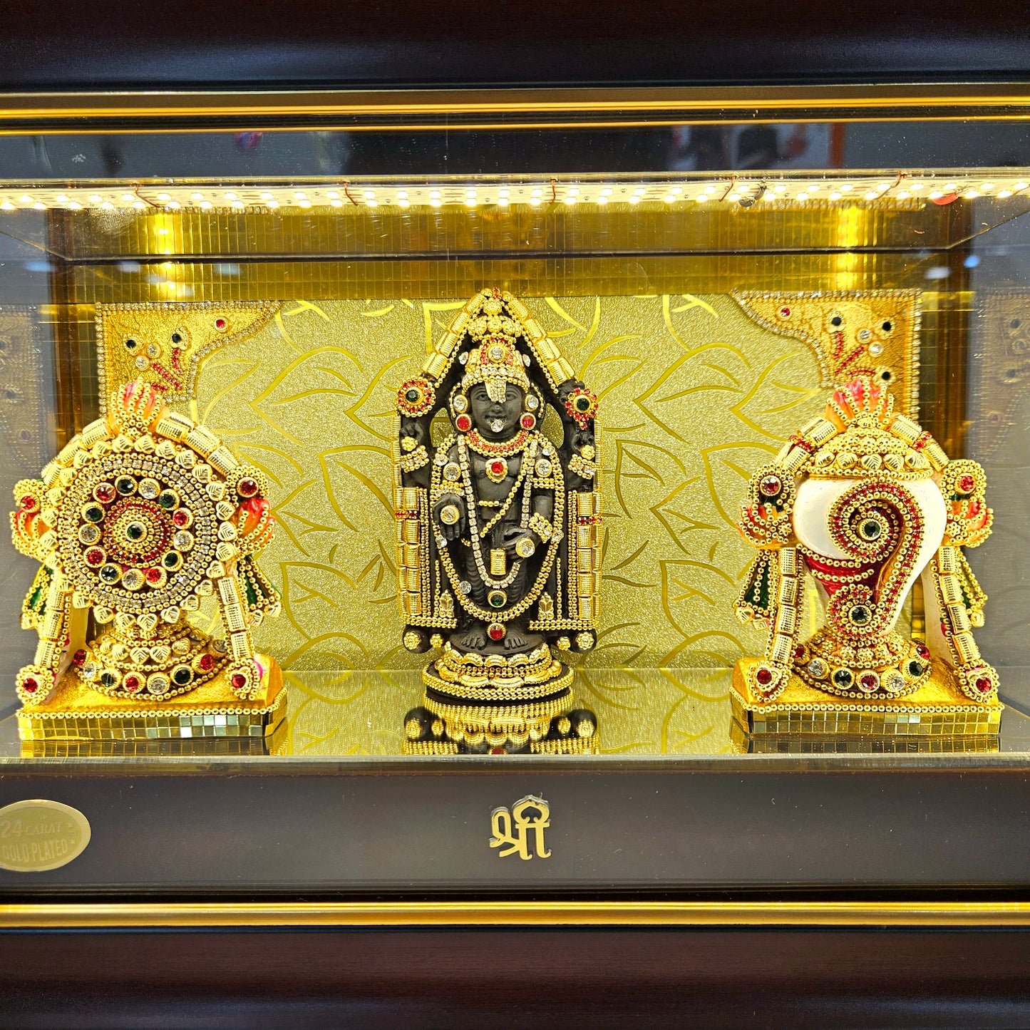 Shank Chakra with Balaji decorated with stones in transparent protective cabin