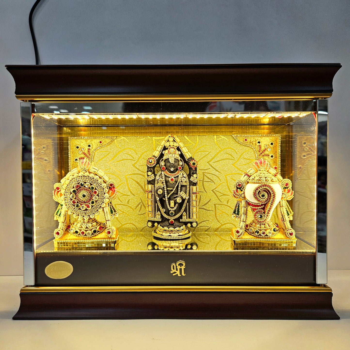 Shank Chakra with Balaji decorated with stones in transparent protective cabin