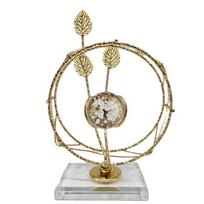 Golden leaf and crystal ball centerpiece resembles the "Crystal Elysian Showpiece" featuring a Crystal base