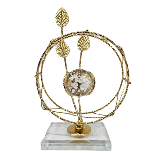 Golden leaf and crystal ball centerpiece resembles the "Crystal Elysian Showpiece" featuring a Crystal base