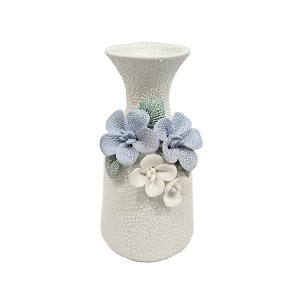 water droplets textured ceramic vase with light blue and white flowers vase